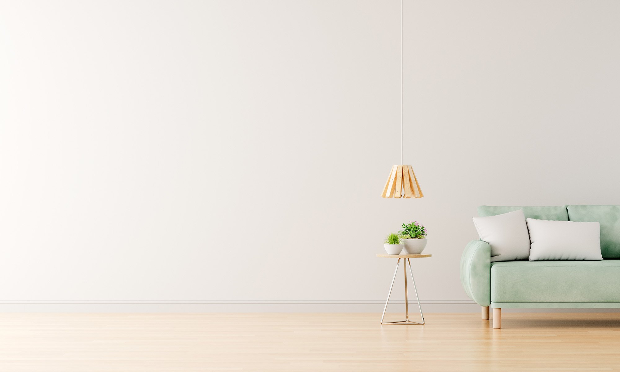 Minimalistinen sisustus; vaaleanvihreä sohva, pöytä kasveilla, puinen riippuvalaisin, vaalea puulattia.